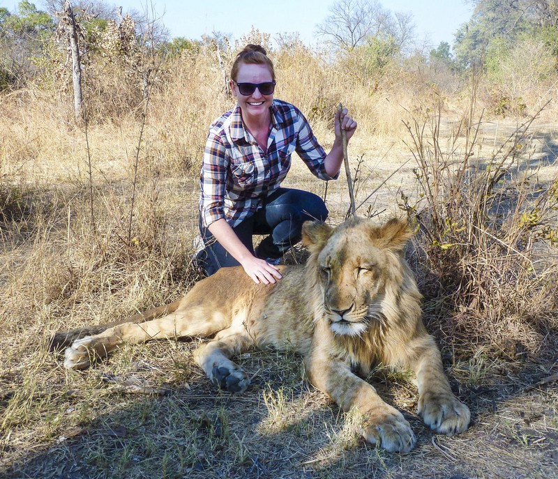 Amanda & a young lion in Livingstone, Zambia. Photo/A.Griffin