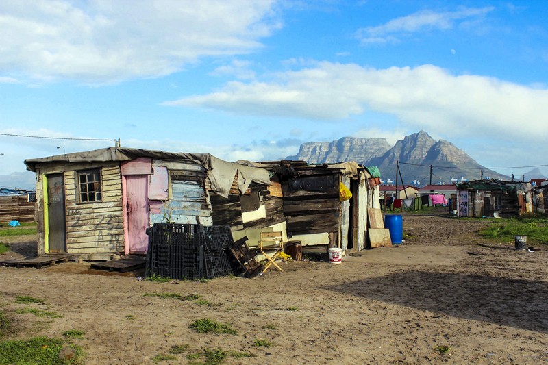 Typical house in the township we visited just outside Cape Town, South Africa. In the background is the famous Table Mountain. Photo/A.Griffin